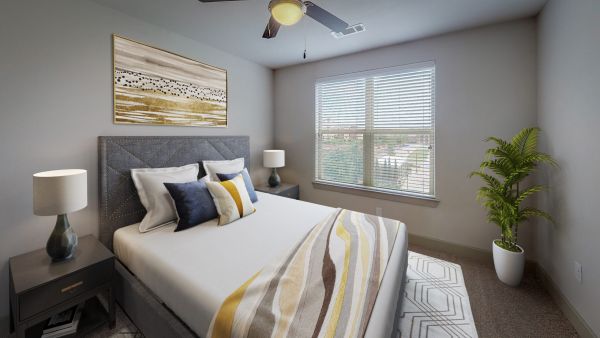 The Civic at Frisco Square apartment bedroom featuring large window, ceiling fan, and furnished with contemporary bed