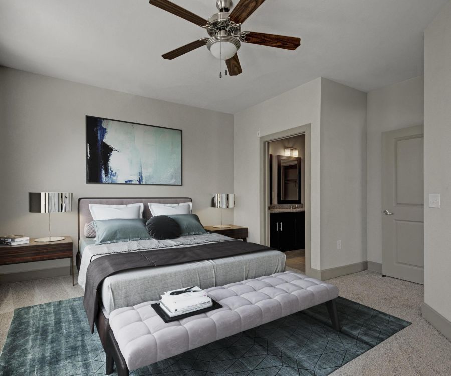 The Civic at Frisco Square apartment bedroom featuring large window, ceiling fan, and furnished with contemporary bed