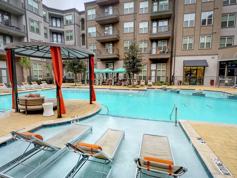 The Civic at Frisco Square apartment pool with cabanas and outdoor seating